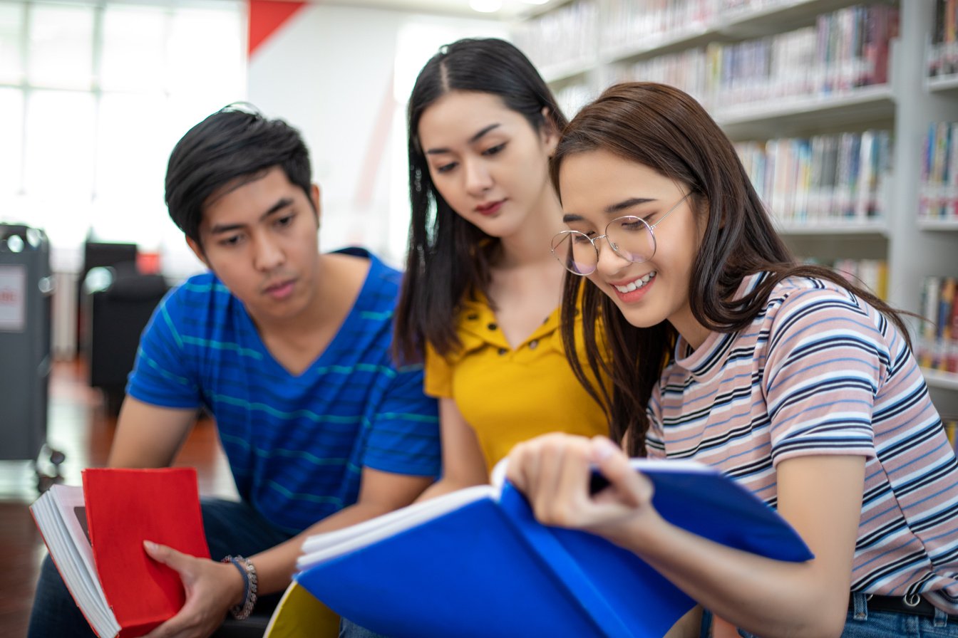 Group of Students Studying in the Library 